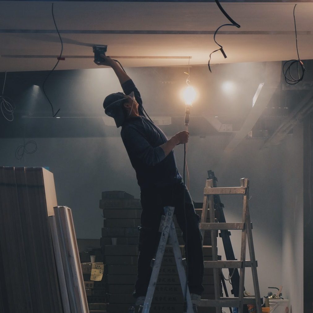 man on white ladder